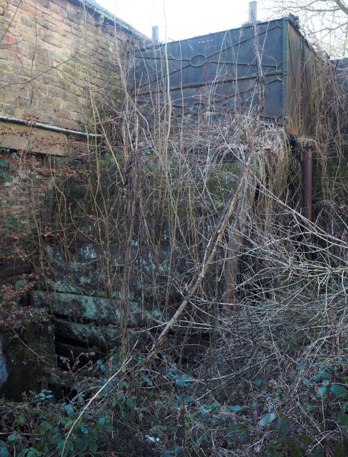 Photograph of the Low Matlock water wheel in its current dilapidated state